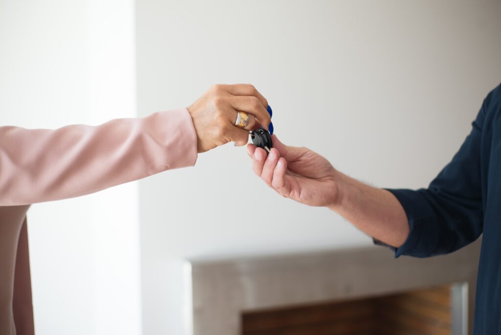 Vancouver Real Estate: Agent handing over the home keys.