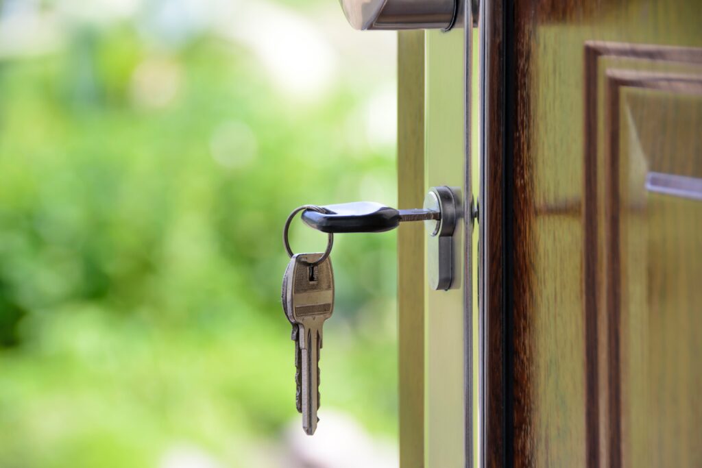 Keys hanging at the main door of the house.